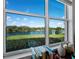 Bright window highlights beautiful lake view and manicured lawn at 8284 Barton Farms Blvd, Sarasota, FL 34240