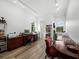 Spacious office with light wood floors, two desks, computer equipment, and ample natural light at 8284 Barton Farms Blvd, Sarasota, FL 34240