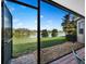 Scenic view of the lake from the screened patio, offering a peaceful retreat at 8284 Barton Farms Blvd, Sarasota, FL 34240