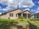 The house is located on a large lot and boasts a back patio at 9043 39Th Street E Cir, Parrish, FL 34219