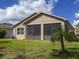 Well-maintained backyard features lush landscaping and a screened patio at 9043 39Th Street E Cir, Parrish, FL 34219