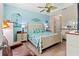 Charming bedroom with a large bed, tropical-themed decor, and ample natural light at 9043 39Th Street E Cir, Parrish, FL 34219