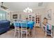 Cozy dining area with a blue tablecloth, display cabinet, and comfortable seating at 9043 39Th Street E Cir, Parrish, FL 34219