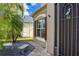 Inviting exterior featuring a stone bench, palm tree, and a charming window with dark red shutters at 9043 39Th Street E Cir, Parrish, FL 34219