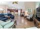 Spacious living room with open layout connecting to kitchen and dining area at 9043 39Th Street E Cir, Parrish, FL 34219