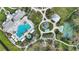 An aerial perspective of community center, pool, playground, and recreation spaces at 11231 Woodlake Way, Parrish, FL 34219