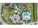 Overhead view of community amenities including a pool, playground, basketball and soccer field at 11231 Woodlake Way, Parrish, FL 34219