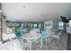 Bright dining area with views of outdoors, featuring tables and chairs for residents' enjoyment at 11231 Woodlake Way, Parrish, FL 34219