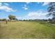 Expansive green field, perfect for sports, recreation, and community activities in a residential area at 11231 Woodlake Way, Parrish, FL 34219
