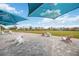 Comfortable Adirondack chairs under shade structures, inviting residents to relax and socialize at 11231 Woodlake Way, Parrish, FL 34219