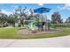 A vibrant community playground with slides and climbing structures for children to enjoy at 11231 Woodlake Way, Parrish, FL 34219