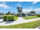 A picturesque community recreation center with lush landscaping and inviting entrance on a sunny day at 11231 Woodlake Way, Parrish, FL 34219