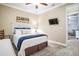 Bedroom featuring neutral walls, tv, and a comfortable bed at 1129 Rotonda Cir, Rotonda West, FL 33947
