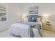 Comfortable bedroom featuring plush bedding, stylish lamps, and a serene color palette at 11728 Strandhill Ct, Lakewood Ranch, FL 34202