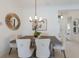 Dining room featuring modern lighting fixtures and seating for four at 11728 Strandhill Ct, Lakewood Ranch, FL 34202