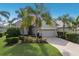 Charming single-story home with lush landscaping and a paver driveway at 11728 Strandhill Ct, Lakewood Ranch, FL 34202