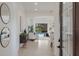 Inviting foyer leading to an open-concept living area with views of the pool and outdoor space at 11728 Strandhill Ct, Lakewood Ranch, FL 34202