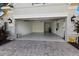 Spacious two-car garage with epoxy flooring and ample storage space at 11728 Strandhill Ct, Lakewood Ranch, FL 34202