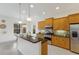 Open kitchen featuring granite counters, stainless appliances, and a bright breakfast nook at 11728 Strandhill Ct, Lakewood Ranch, FL 34202