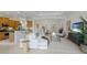 Open-concept living room area with adjacent kitchen and dining room at 11728 Strandhill Ct, Lakewood Ranch, FL 34202