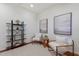 Cozy living room with bookshelves and comfortable chairs at 11728 Strandhill Ct, Lakewood Ranch, FL 34202
