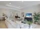 Bright and airy living room with large windows and a neutral color palette at 11728 Strandhill Ct, Lakewood Ranch, FL 34202