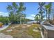 Outdoor entertaining area featuring a grill, dining area, and beautiful water views at 1406 Tangier Way, Sarasota, FL 34239