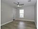 Simple bedroom offering natural light, wood-look floors, and is ready for your personal touches at 1471 Palmwood Dr, Sarasota, FL 34232