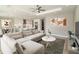 Cozy living room featuring stylish decor, a comfortable sectional sofa, and an open floor plan to the kitchen at 1471 Palmwood Dr, Sarasota, FL 34232