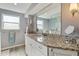 Stylish bathroom features granite countertop, sleek vanity, large mirror, and a glass-enclosed shower at 198 Salem Nw Ave, Port Charlotte, FL 33952