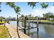 Waterfront home with private boat dock featuring a boat lift and easy access to the canal at 198 Salem Nw Ave, Port Charlotte, FL 33952