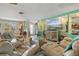 Bright living room boasts stylish decor, neutral tones, and comfortable reclining leather seating at 198 Salem Nw Ave, Port Charlotte, FL 33952