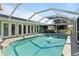 Screened-in pool features clear water, deck space, and an open sky for leisure and relaxation at 198 Salem Nw Ave, Port Charlotte, FL 33952
