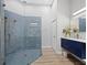Stylish bathroom features a glass shower, modern vanity, and decorative accents at 2065 Harbour Links Dr # 5, Longboat Key, FL 34228