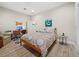 Cozy bedroom with a patterned bedspread, desk and chair for a work space at 2065 Harbour Links Dr # 5, Longboat Key, FL 34228