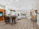 Open concept kitchen featuring a large island, wood floors, and modern design at 2065 Harbour Links Dr # 5, Longboat Key, FL 34228
