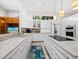 Bright, modern kitchen with large island and stainless steel appliances at 2065 Harbour Links Dr # 5, Longboat Key, FL 34228