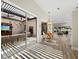 Bright and sunny living room with hardwood floors and view of the lanai at 2065 Harbour Links Dr # 5, Longboat Key, FL 34228