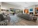 Bright and airy living room featuring wood floors, a fireplace, comfortable seating, and an outdoor view at 2065 Harbour Links Dr # 5, Longboat Key, FL 34228
