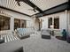 Cozy outdoor patio with stylish seating, ceiling fans, and an open view, perfect for relaxing at 2065 Harbour Links Dr # 5, Longboat Key, FL 34228