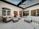 Outdoor patio with comfortable seating, ceiling fans, and stylish decor, perfect for entertaining at 2065 Harbour Links Dr # 5, Longboat Key, FL 34228