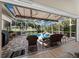 Enjoy outdoor living on this large, covered patio with views of the pool and golf course at 2065 Harbour Links Dr # 5, Longboat Key, FL 34228