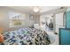 Bright bedroom features a tropical-themed bed and access to the outdoor patio at 2501 W Marion Ave, Punta Gorda, FL 33950