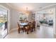 Dining area with glass top table and view of the outdoor pool, and access to the living room at 2501 W Marion Ave, Punta Gorda, FL 33950