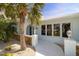 Charming front exterior with stucco arches and a walkway to the front door at 2501 W Marion Ave, Punta Gorda, FL 33950