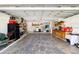 The spacious, organized garage features ample storage, shelving, and a convenient utility area at 2501 W Marion Ave, Punta Gorda, FL 33950