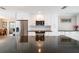 Modern kitchen featuring stainless steel appliances, granite countertops, and white cabinetry at 2501 W Marion Ave, Punta Gorda, FL 33950