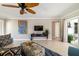 Inviting living room featuring neutral walls, tile flooring, and sliding glass doors for natural light at 2501 W Marion Ave, Punta Gorda, FL 33950