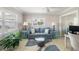 Bright living room offers a comfy sofa, decorative lamps, and a modern rug at 2501 W Marion Ave, Punta Gorda, FL 33950