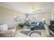 Bright living room boasts a comfortable sofa, stylish furnishings, and tile flooring at 2501 W Marion Ave, Punta Gorda, FL 33950